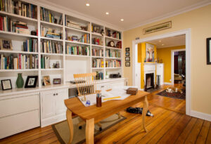 Old Town Row Home Office with Wall of Built-in Shelves