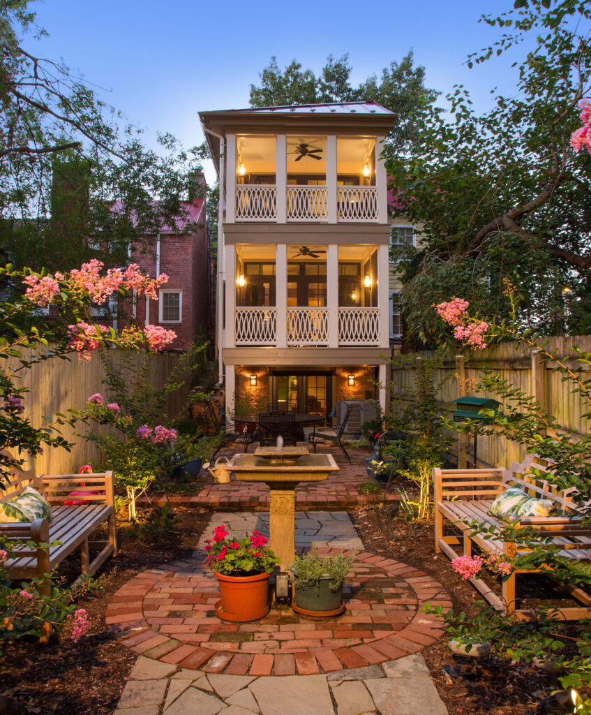 Rear view of Old Town row home with second and third floor screen porches